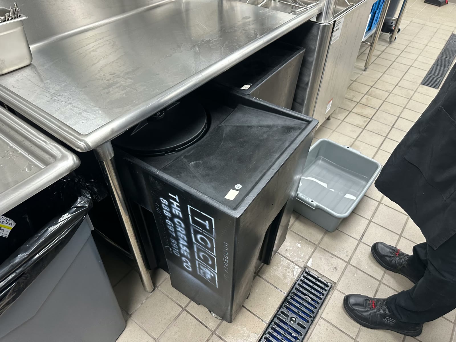 Sealed used cooking oil collection container in a commercial kitchen