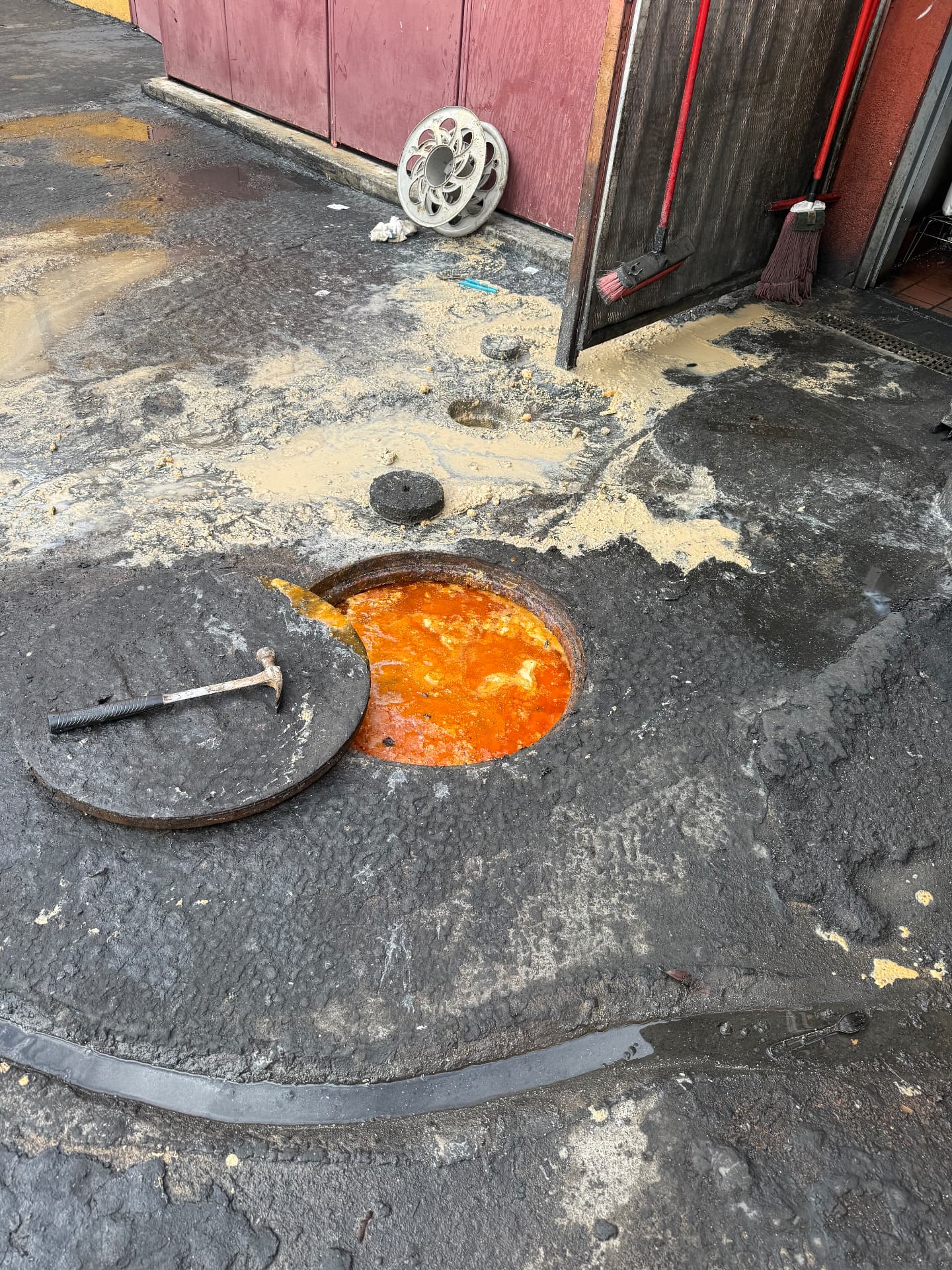 Commercial grease trap full of grease before cleaning
