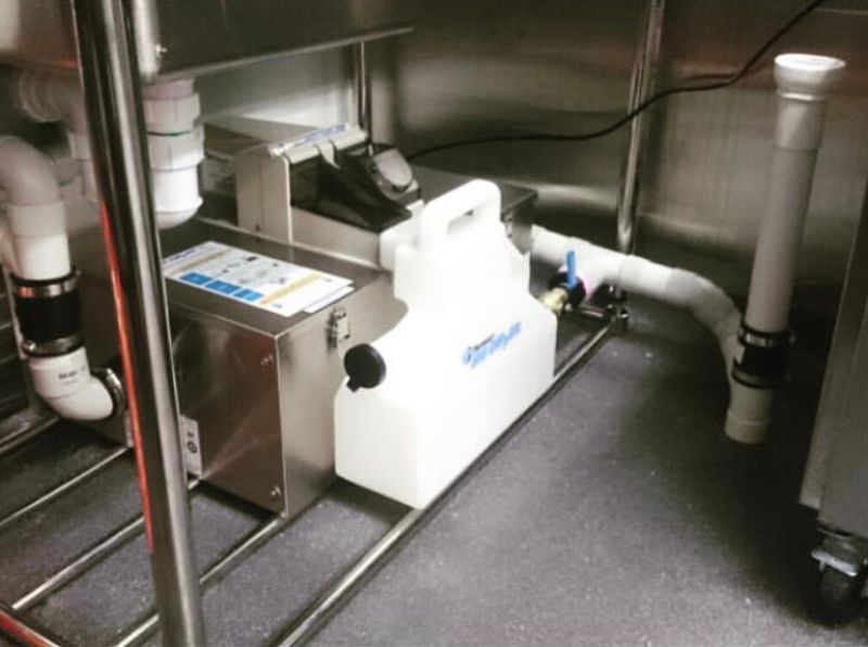 Indoor under-sink grease trap in a Eastvale commercial kitchen
